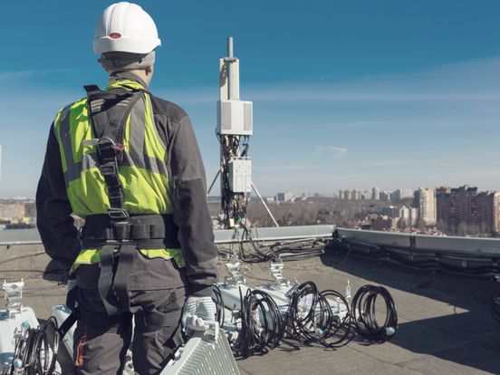 Worker on roof installation photo